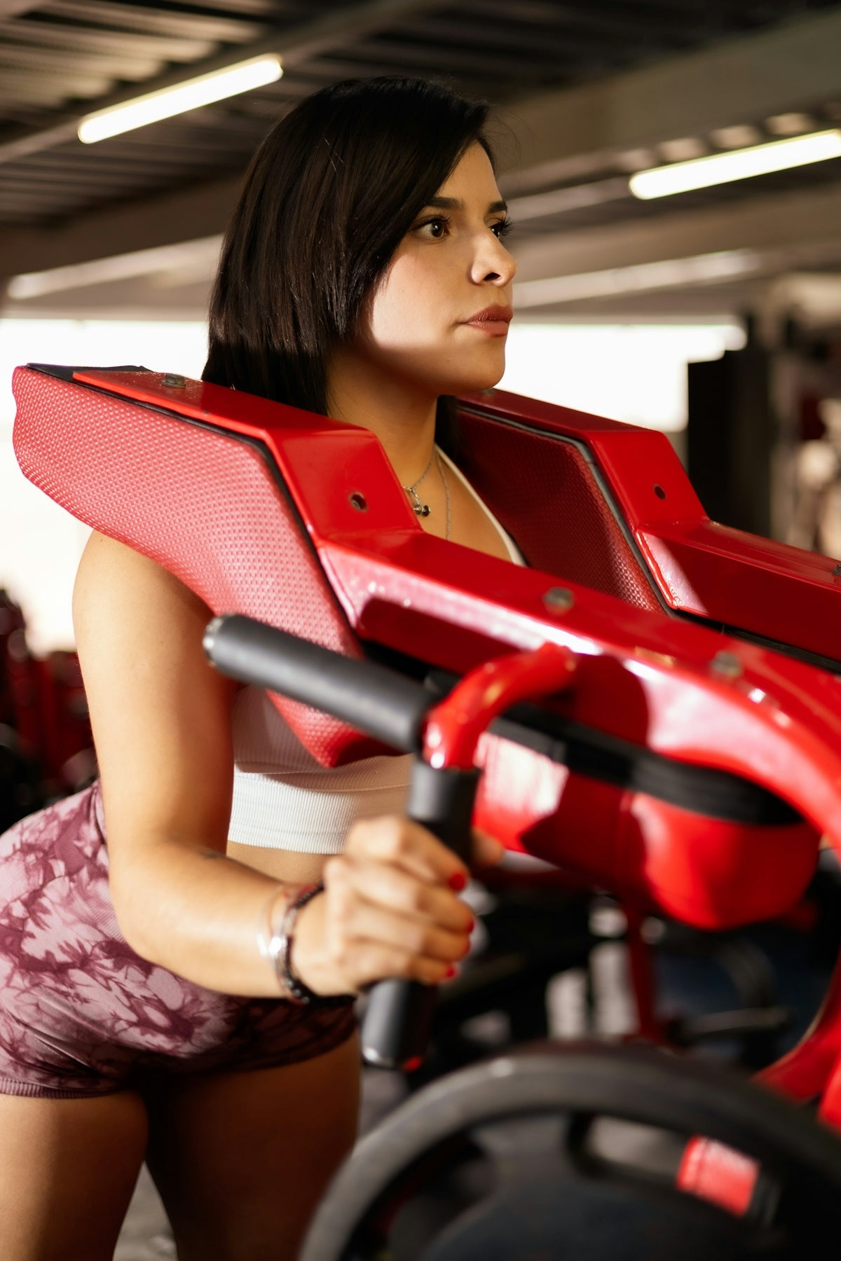 Woman is working out in a gym.